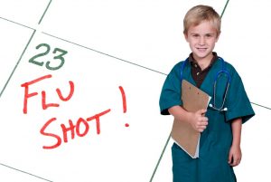 A child showing a calendar reminder for a Flu Shot