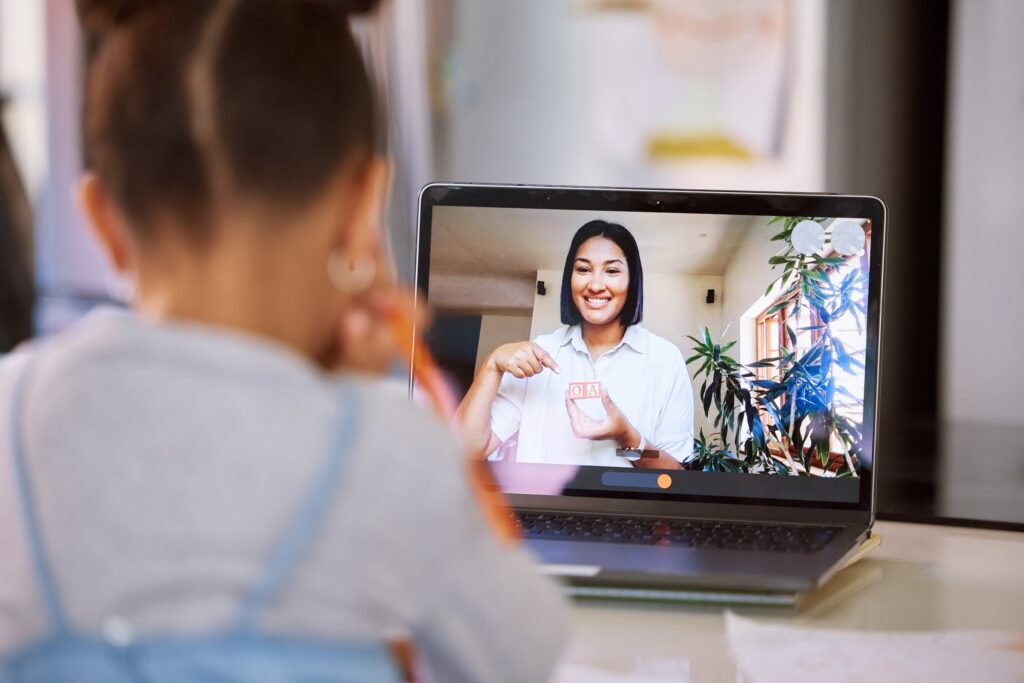 Little Girl on a Video Call with her Teacher